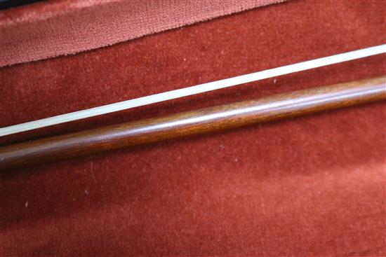 A silver mounted violin bow, an ivory mounted violin bow and a late 19th century German violin, cased